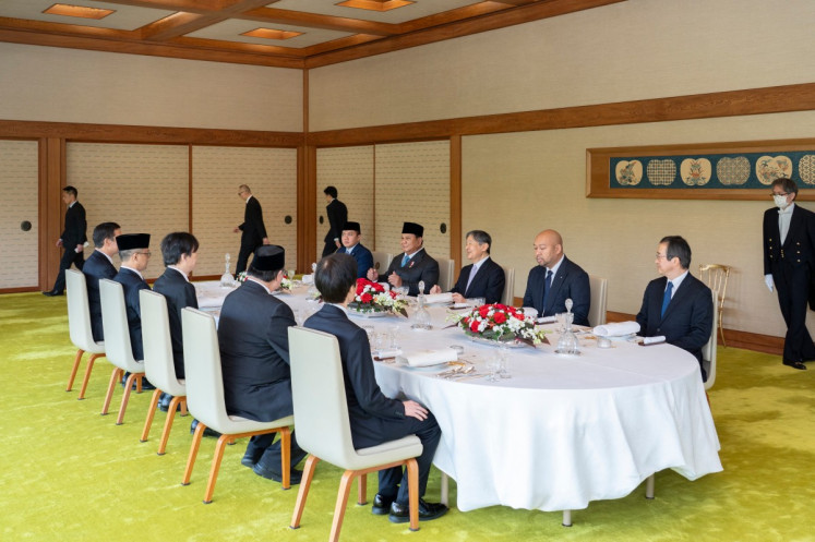 This handout photo taken on March 30 and released by the Imperial Household Agency of Japan shows President Prabowo Subianto (fourth left) attending a luncheon with Japanese Emperor Naruhito (third left) at the Imperial Palace in Tokyo.