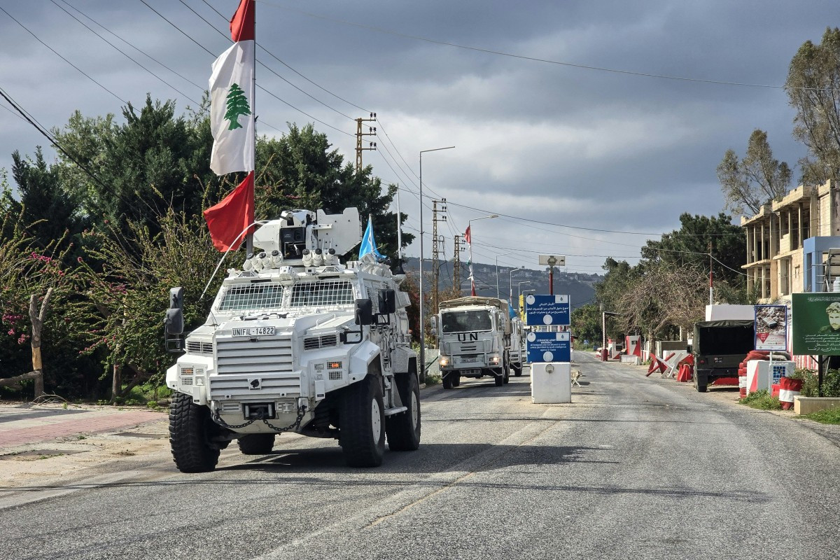 United Nations peacekeepers with the UN Interim Force in Lebanon (UNIFIL) drive past a Lebanese army outpost on March 27 in the area of Naqura in southern Lebanon.