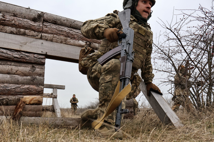 'Fresh meat&rsquo;: A new recruit completes an obstacle course on March 21 during basic training at an undisclosed location in Zaporizhzhia region, Ukraine.