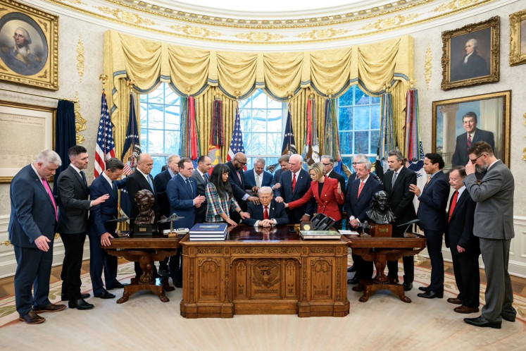 United States President Donald Trump joins evangelical Christian ministers in a group prayer on March 5, 2026, in the Oval Office in Washington, D.C.