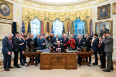 United States President Donald Trump joins evangelical Christian ministers in a group prayer on March 5, 2026, in the Oval Office in Washington, D.C.