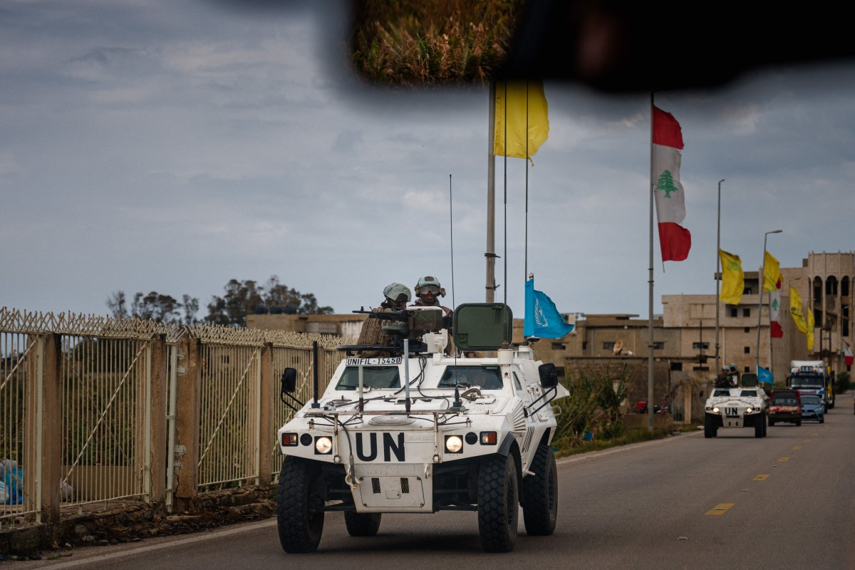 A United Nations Interim Force in Lebanon (UNIFIL) convoy drives on March 23 near the southern Lebanese city of Tyre. The Israeli military said it launched a wave of strikes on Beirut targeting the Iran-backed militant group Hezbollah, after urging residents of several areas to evacuate.