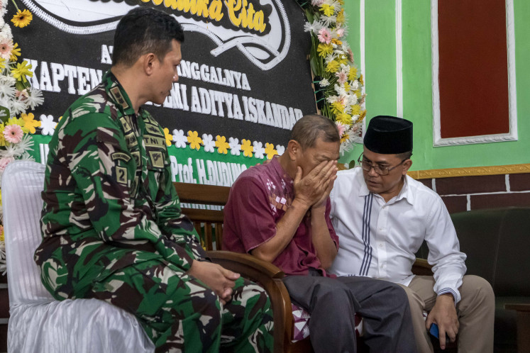 A family member of the late Capt. Zulmi Aditya Iskandar mourns his death on April 1. The soldier was killed while serving with the Indonesian Battalion (Indobatt) in the southern Lebanese municipality of Adchit al-Qusayr under the United Nations Interim Force in Lebanon (UNIFIL).