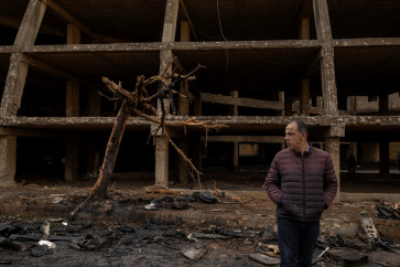 A man stands on the impact site of an Israeli strike on April 1, 20226, amid escalating hostilities between Israel and Hezbollah, as the United States-Israel war on Iran continues, in Beirut, Lebanon.