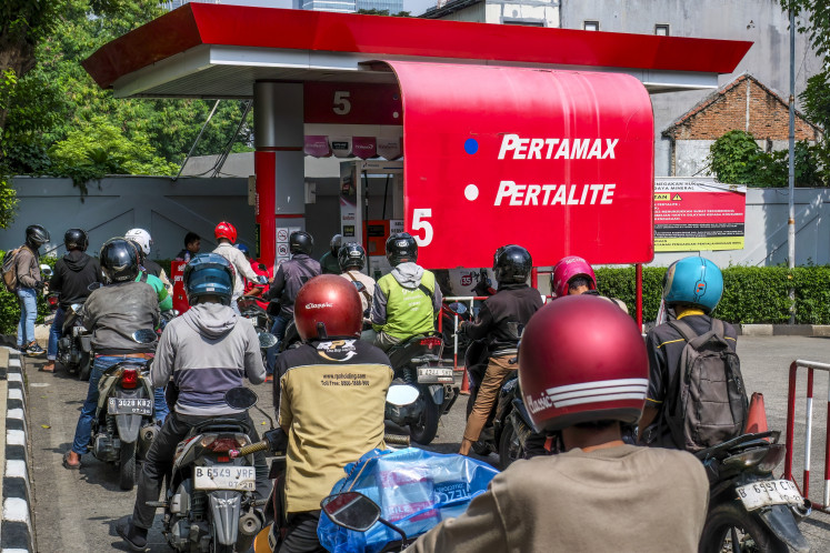 Save the energy: Motorists queue to refuel their motorbikes on April 1, at a gas station in Jakarta. The government has begun enforcing newly announced austerity measures, including a mandatory weekly remote working policy, aimed at cushioning the impact of the United States-Israeli war on Iran.