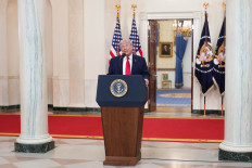 US President Donald Trump speaks during a televised address on the conflict in the Middle East from the Cross Hall of the White House in Washington, DC, on April 1, 2026. President Donald Trump made his case for attacking Iran in his first nationwide address more than a month into the war, insisting the United States was close to victory as his approval rating sinks.