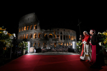 This photo taken and handout on April 3, 2026 by The Vatican Media shows Pope Leo XIV attending the Way of the Cross at the Colosseum as part of the Holy Week celebrations in Rome.