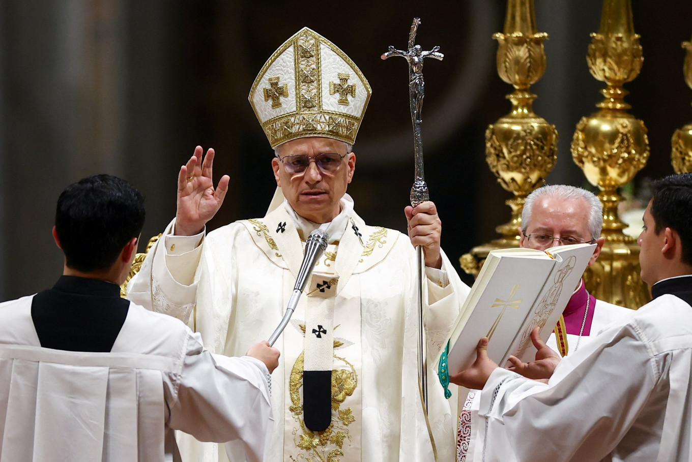 Pope Leo XIV blesses faithful during the Easter Vigil in Saint Peter's Basilica at the Vatican, April 4, 2026. 