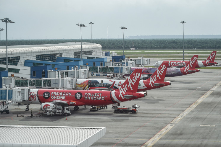 AirAsia airplanes are pictured on the tarmac at Kuala Lumpur International Airport in Sepang on Jan. 8, 2024.