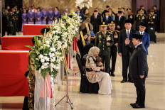 President Prabowo Subianto (right) salutes the coffins of Indonesian soldiers killed while serving with the United Nations Interim Force in Lebanon (UNIFIL) on April 4, 2026, at Soekarno-Hatta International Airport in Tangerang, Banten.