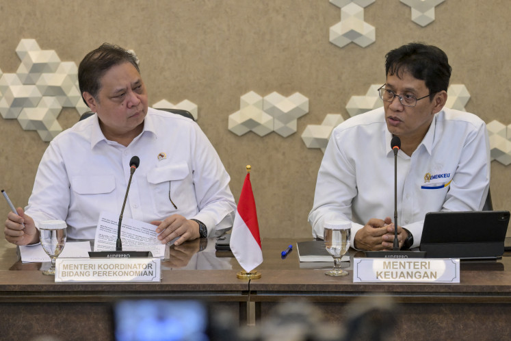 Hard decision: Coordinating Economy Minister Airlangga Hartarto (left) and Finance Minister Purbaya Yudhi Sadewa address a press briefing in Jakarta on April 6, 2026, regarding the increase in surcharge for aviation fuel.