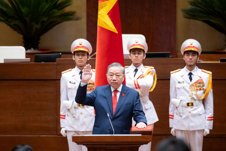 Vietnam's Communist Party General Secretary To Lam takes his oath as Vietnam's President during the legislature's session at the National Assembly in Hanoi, Vietnam, April 7, 2026. 