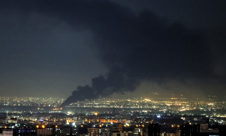 Smoke rises from the site of a US-Israeli strike on the Iranian capital Tehran on April 7, 2026. 