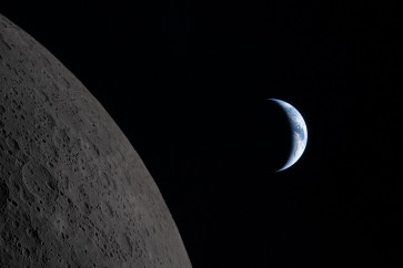 This handout picture released on April 7, 2026, by NASA shows Earth drawing closer to passing behind the Moon, about six minutes before &ldquo;Earthset,&ldquo; as seen from the Orion spacecraft on April 6, 2026. 