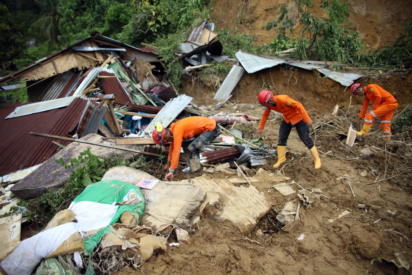 Searching for life: A joint search and rescue team conducts a search on April 8 for victims of a landslide in Sembahe village, Sibolangit district, Deli Serdang, North Sumatra. The Deli Serdang Disaster Mitigation Agency (BPBD) reported five dead and one injured following the landslide that occurred on Tuesday.