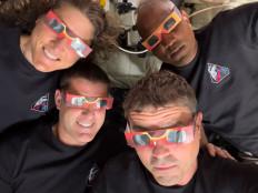 Eclipse magic: This handout picture released on Tuesday, April 6, 2026, by NASA shows Artemis II crew members mission specialist Christina Koch (top left), mission specialist Jeremy Hansen (bottom left), commander Reid Wiseman (bottom right) and pilot Victor Glover using eclipse viewers to protect their eyes at key moments during the solar eclipse they experienced during their lunar flyby, on Monday.