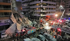 First responders and residents gather at the site of an Israeli airstrike in Beirut's Tallet al-Khayyat neighborhood, on April 8, 2026. At least 112 people were killed and 837 more were wounded in Lebanon on April 8 after Israel launched a wave of strikes unprecedented in the current war.