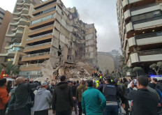 First responders and residents gather at the site of an Israeli airstrike in Beirut's Tallet al-Khayyat neighbourhood, on April 8, 2026. 