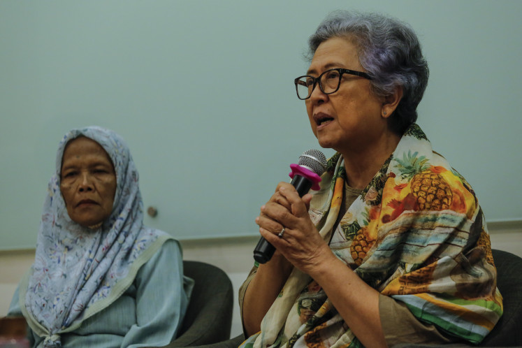 Ita Fatia Nadia (right), advocate for May 1998 rape victims, and plaintiff Kusmiyati speak on April 7, 2026, at a press conference at Amnesty International Indonesia in Jakarta.