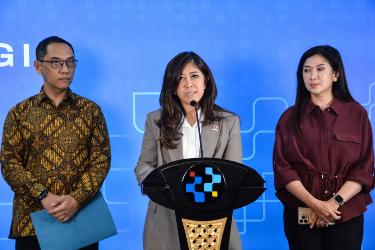 Communications and Digital Minister Meutya Hafid (center) delivers a press statement on the implementation of Government Regulation No. 17/2025 on Electronic System Governance for Child Protection, known as PP Tunas, in Jakarta, on April 9, 2026.