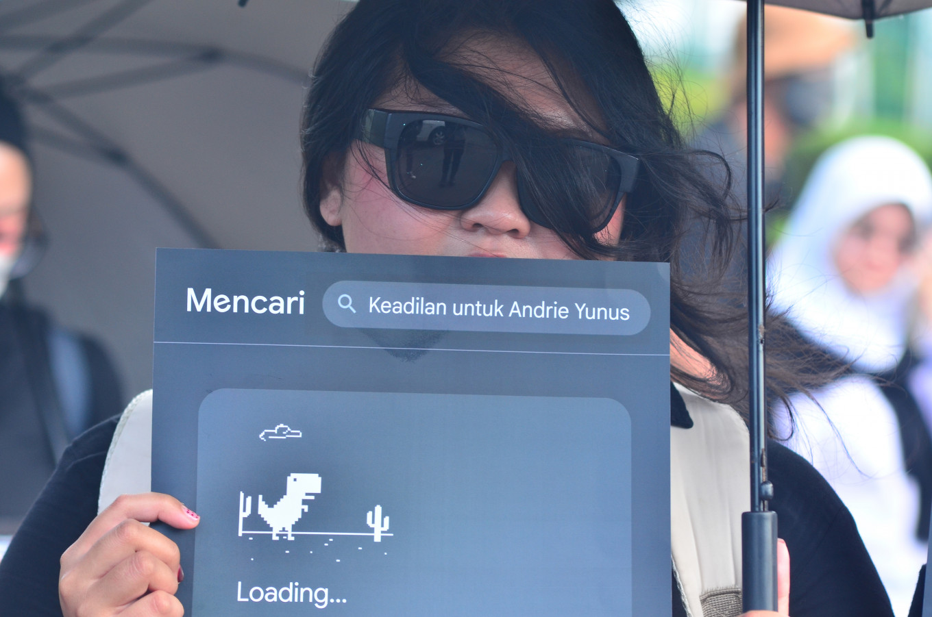 Dig deeper: A human rights activist affiliated with the Justice for Victims Solidarity Network holds a poster on April 9, 2026, during the 903rd &ldquo;Kamisan&rdquo; protest across from the Merdeka Palace in Jakarta. The demonstrators urged the formation of a joint fact-finding team to uncover the details of the acid attack on activist Andrie Yunus.