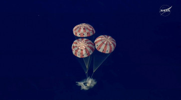 The Artemis II crew capsule splashes down in the Pacific Ocean in this screengrab from a livestream video after the Artemis II crew's flyby of the Moon, April 10, 2026. 