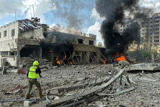 First responders rush to the site of an Israeli airstrike that targeted the Lebanese State Security Center in the Southern Lebanese city of Nabatieh on April 10, 2026.