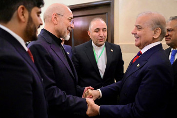 This handout photograph taken on April 11, 2026 and released by Pakistan's Prime Minister Office shows Pakistan's Prime Minister Shehbaz Sharif (second right) with Foreign Minister Ishaq Dar (right) greeting Iran's parliamentary speaker Mohammad Bagher Ghalibaf (second left) during their meeting prior to the US-Iran peace talks in Islamabad. An Iranian government delegation met Pakistan's prime minister on April 11 to discuss the terms of planned &ldquo;make or break&ldquo; negotiations to end the Middle East war with a US party led by Vice President JD Vance.