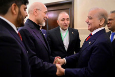 This handout photograph taken on April 11, 2026 and released by Pakistan's Prime Minister Office shows Pakistan's Prime Minister Shehbaz Sharif (second right) with Foreign Minister Ishaq Dar (right) greeting Iran's parliamentary speaker Mohammad Bagher Ghalibaf (second left) during their meeting prior to the US-Iran peace talks in Islamabad. An Iranian government delegation met Pakistan's prime minister on April 11 to discuss the terms of planned &ldquo;make or break&ldquo; negotiations to end the Middle East war with a US party led by Vice President JD Vance.