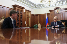 Russian President Vladimir Putin attends a meeting with Head of the Roscosmos space corporation Dmitry Bakanov at the Kremlin in Moscow, Russia April 11, 2026.