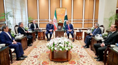 This handout photograph taken on April 11, 2026 and released by Pakistan's Prime Minister Office shows Pakistan's Army Chief and Field Marshal Syed Asim Munir (right), Foreign Minister Ishaq Dar (2nd right), Prime Minister Shehbaz Sharif (third right) during their meeting with Iran's parliamentary speaker Mohammad Bagher Ghalibaf (fourth left) and Foreign Minister Abbas Araghchi (second left) prior to the US-Iran peace talks in Islamabad. 