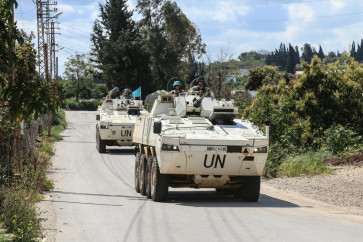 Members of the UN peacekeeping force in Lebanon (UNIFIL), in armored vehicles, patrol the road of the southern Lebanese village of Tair Debba on April 12, 2026.