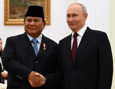 President Prabowo Subianto (left) and Russian President Vladimir Putin shake hands in a photo op on April 13, 2026, during their meeting at the Kremlin in Moscow.