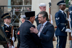 United States Defense Secretary Pete Hegseth (center right) greets Indonesian Defense Minister Sjafrie Sjamsoeddin on April 13, 2026, during an honor cordon at the Pentagon in Arlington, Virginia, just outside Washington, D.C.