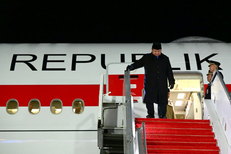 President Prabowo Subianto walsk down the stairs after disembarking the presidential aircraft on April 13 in Paris.