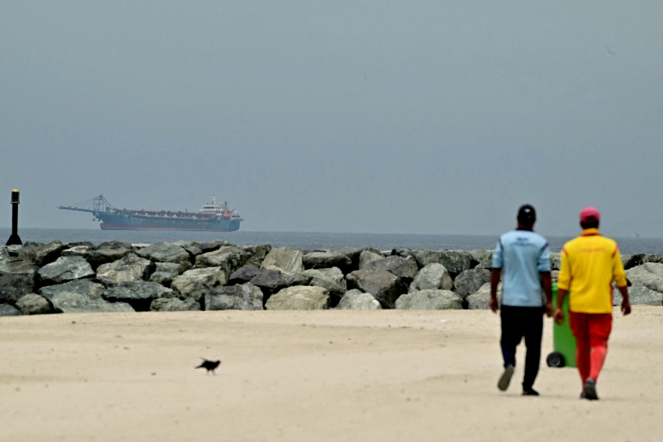 Troubled waters: A ship is seen in the Persian Gulf off the coast of Sharjah on Monday, April 13, 2026, the day after the failure of United States-Iran peace talks.