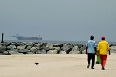 Troubled waters: A ship is seen in the Persian Gulf off the coast of Sharjah on Monday, April 13, 2026, the day after the failure of United States-Iran peace talks.
