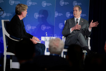 US Treasury Secretary Scott Bessent speaks with Bjorn Lomborg during an event hosted by the Institute of International Finance in Washington, DC, on April 14, 2026.