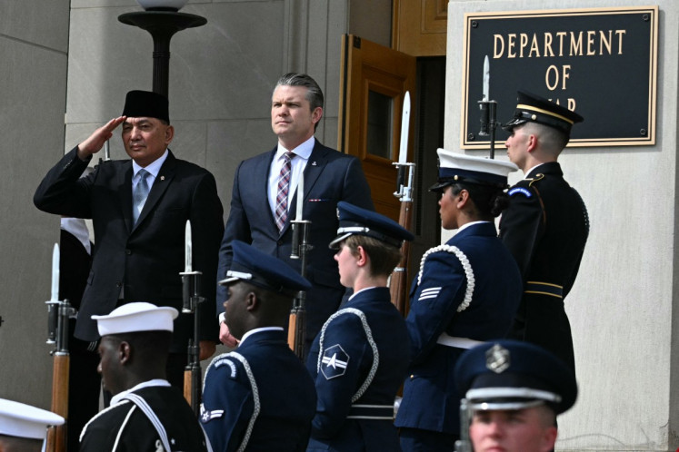 Defense Minister Sjafrie Sjamsoeddin (left) and his United States counterpart Pete Hegseth (right) listen as national anthems are played during an honor cordon welcoming ceremony for the former at the Pentagon in Washington, D.C., on April 13, 2026.