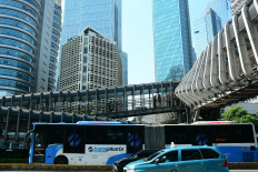 A TransJakarta bus passes through the Senayan area of South Jakarta, Indonesia, on Wednesday, April 15, 2026.