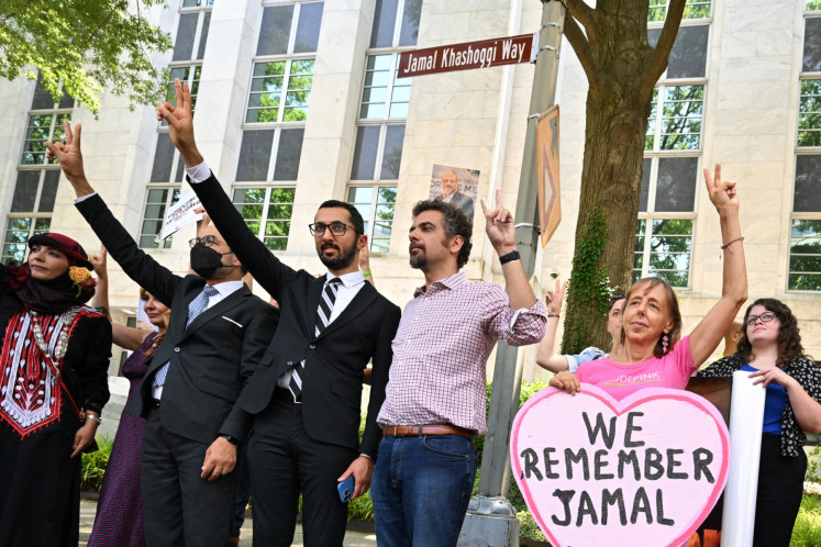 A street sign for Jamal Khashoggi Way is unveiled during a ceremony outside of the Embassy of Saudi Arabia as guests listen to speakers in Washington, DC, in this file photo taken on June 15, 2022. The phenomenon of so-called transnational repression exploded into public awareness with the horrific murder of Khashoggi in Istanbul in 2018.