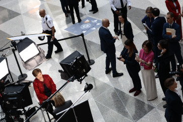International Monetary Fund (IMF) managing director Kristalina Georgieva (left) gives a television interview on April 15, 2026, during the 2026 IMF and World Bank Group Spring Meetings in Washington, DC.
