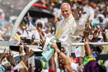 Crowds of devotees: Pope Leo XIV waves to the crowd from the Popemobile on Friday, April 17, 2026, as he arrives to lead the Holy Mass at the area in front of Japoma Stadium in Douala on the fifth day of an 11-day apostolic journey to Africa.