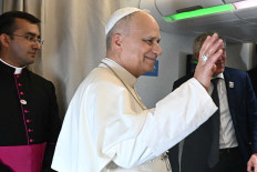 Pope Leo XIV gestures as he speaks to journalists aboard a flight on his way to Luanda, Angola, April 18, 2026. Pope Leo XIV is on an apostolic visit to Angola.