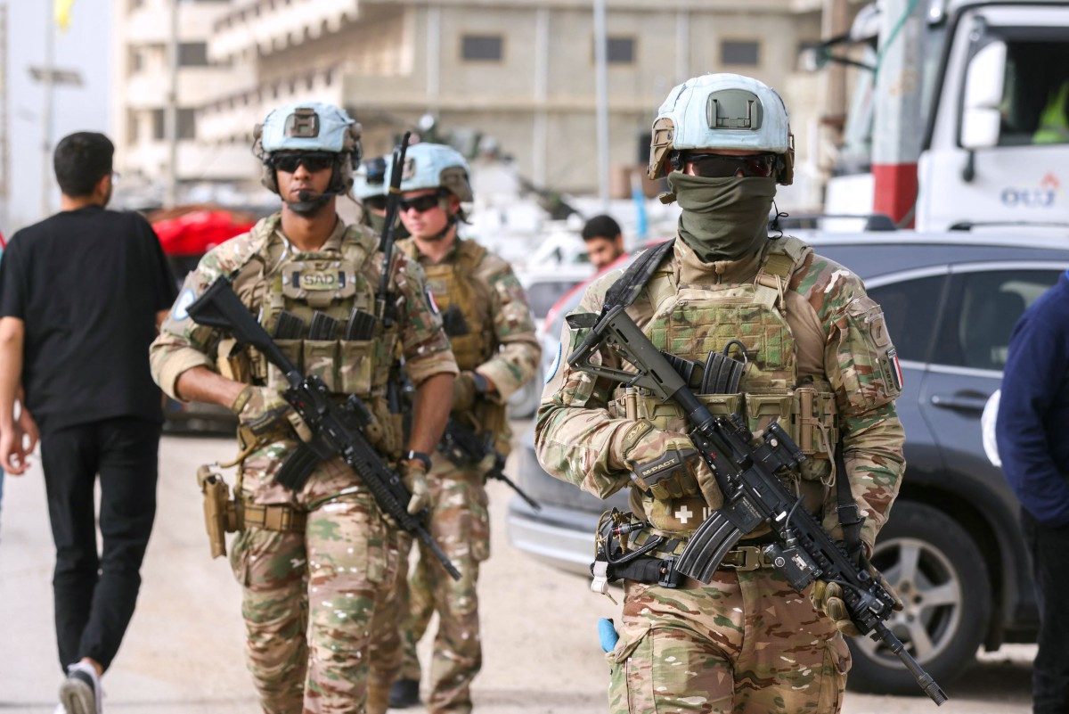 A French contingent of the United Nations Interim Force in Lebanon (UNIFIL) patrols the area as displaced residents make their way back to their homes on April 18 in the southern Lebanese area of Al-Qasmiyeh.