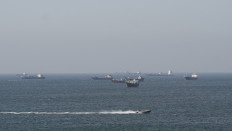 Ships and tankers in the Strait of Hormuz off the coast of Musandam, Oman, April 18, 2026. 