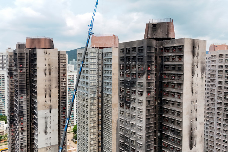 A drone view shows Wang Fuk Court apartment complex after a deadly fire last year, in Hong Kong, China, April 16, 2026.