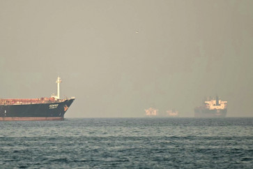Cargo ships and tankers are seen off the coast city of Fujairah, in the Strait of Hormuz in the northern Emirate on February 25, 2026.