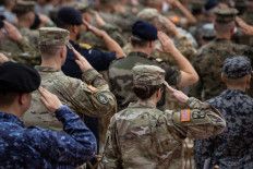 Philippine and United States soldiers salute during the flag ceremony at the opening ceremony of the US-Philippines &ldquo;Balikatan&ldquo; joint military exercises at Camp Aguinaldo in Quezon City, Metro Manila, tje Philippines, on April 20, 2026.