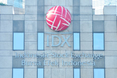 The logo of the Indonesia Stock Exchange (IDX) is seen at the IDX building in Jakarta on April 19, 2026. 
